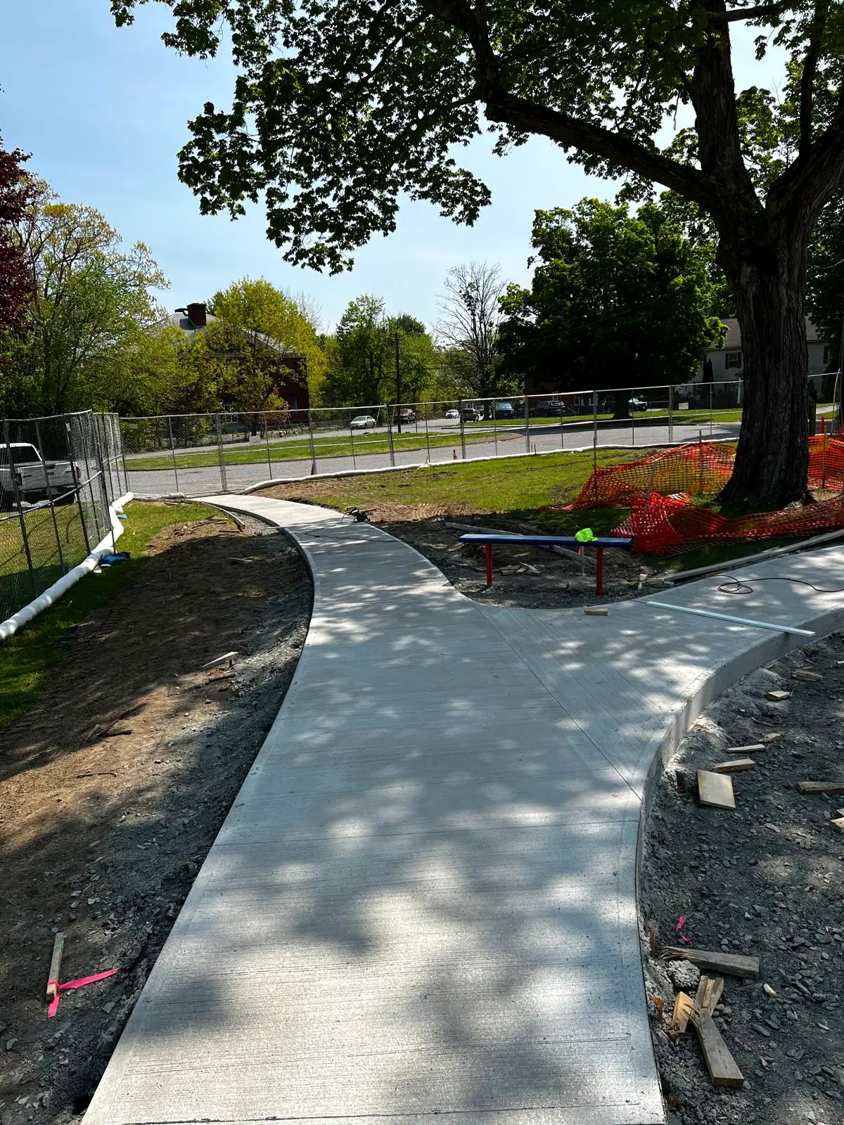 Freshly poured concrete walkway during outdoor installation, the same forming and finish work WR Concrete brings to steps and landings