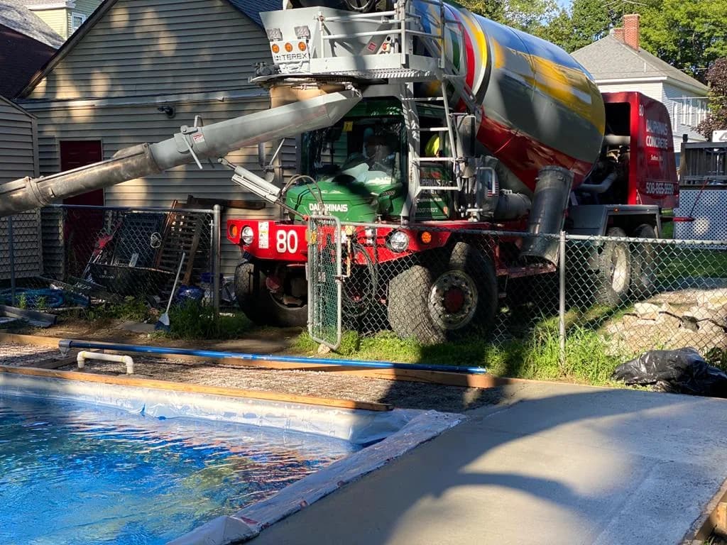 Ready-mix truck pouring the new pool deck